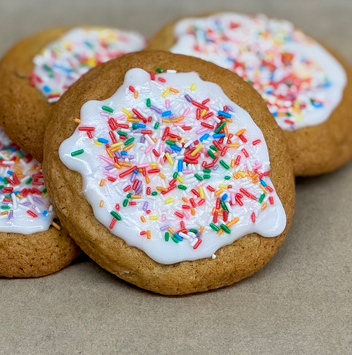 Cookies with white icing and colorful sprinkles