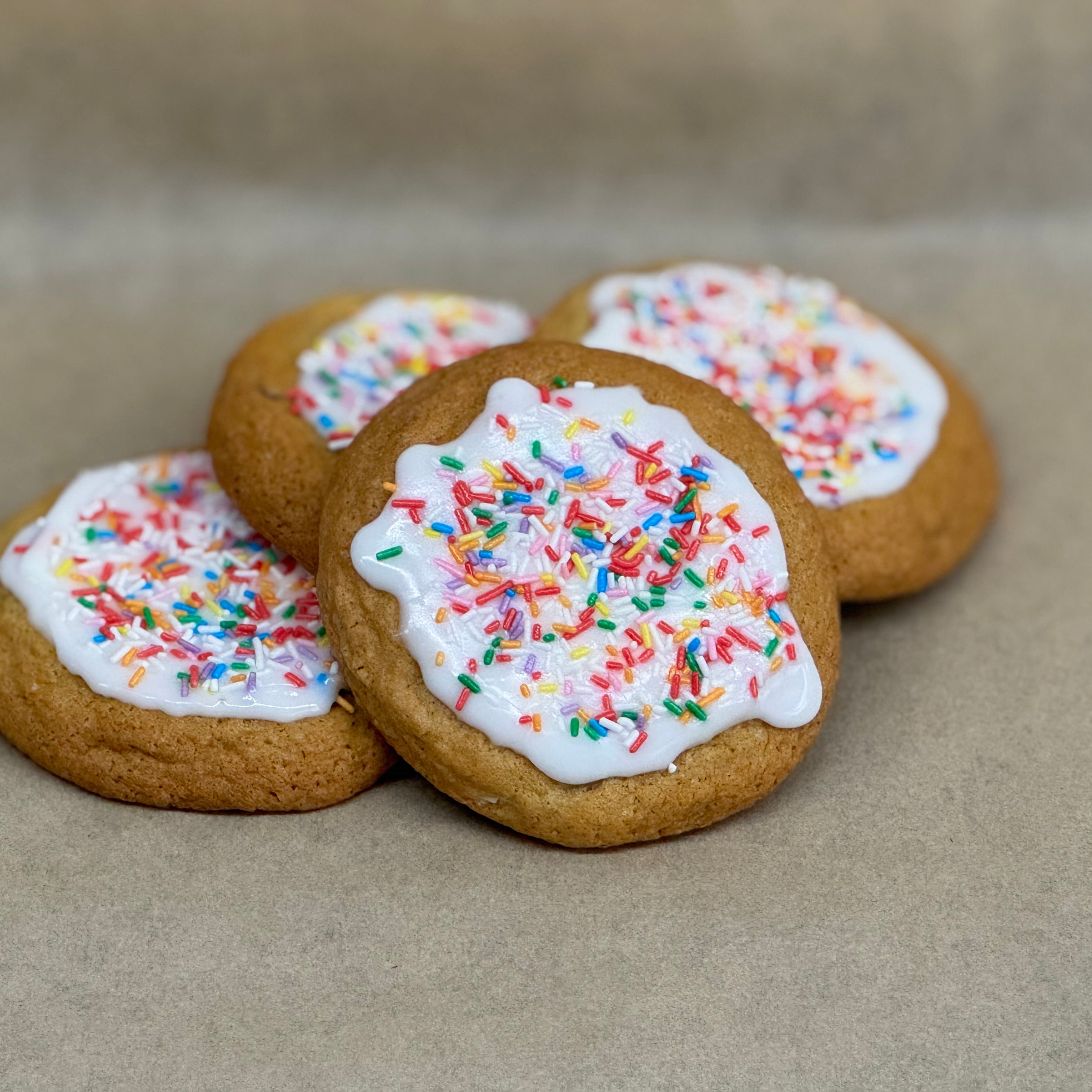 Cookies with white icing and colorful sprinkles