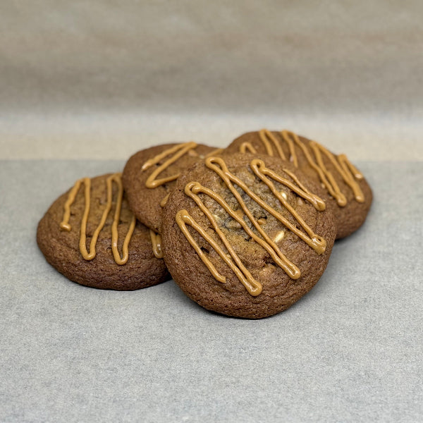Peanut butter gooey cookie topped with peanut butter drizzle.