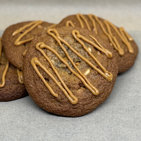 Peanut butter gooey cookie topped with peanut butter drizzle.