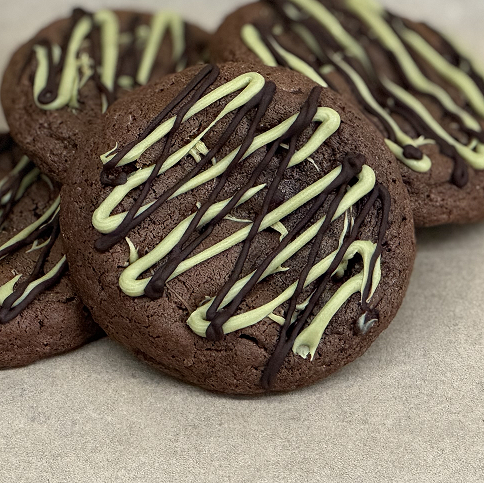 Dark chocolate gooey cookie with pistachio cream and dark chocolate topping.