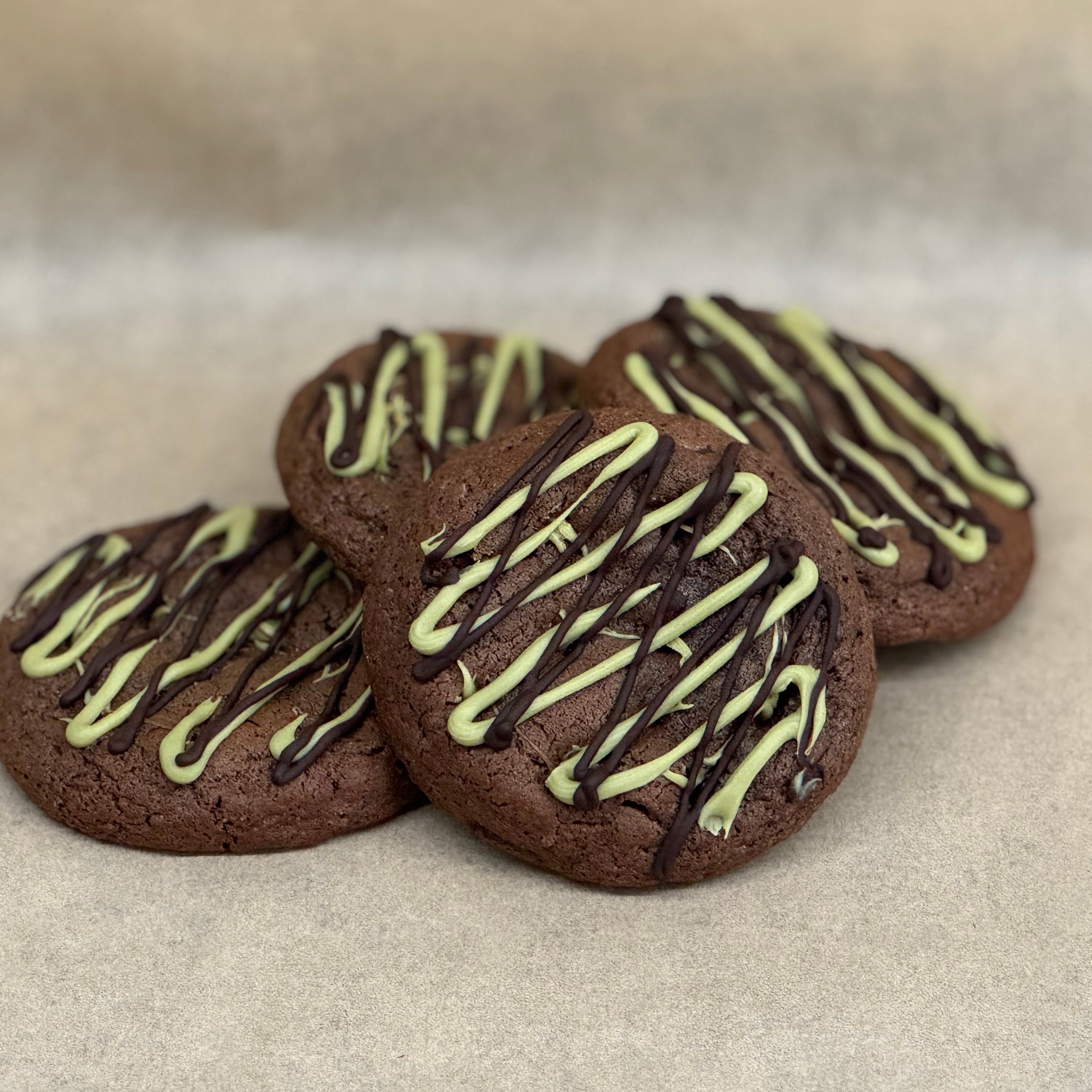 Dark chocolate gooey cookie with pistachio cream and dark chocolate topping.