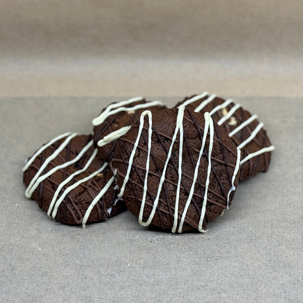 Chocolate cookies with white drizzle.