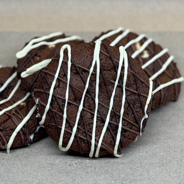 Chocolate cookies with white drizzle